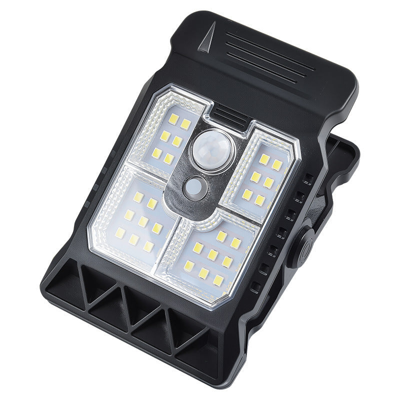 Solar powered motion sensor clip light for outdoor walls
